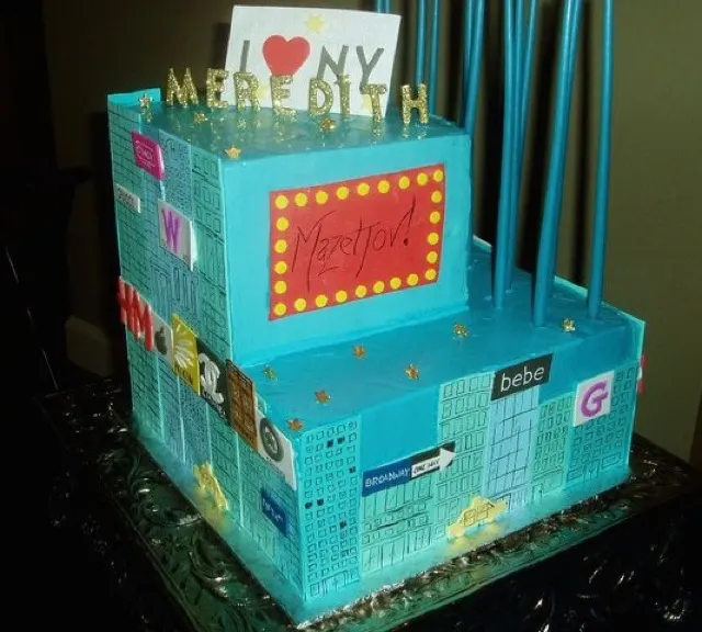 Custom teal fondant celebration cake with a marquee design