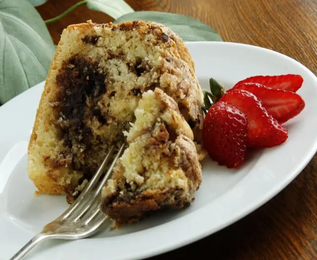 Slice of coffee cake with fresh strawberries