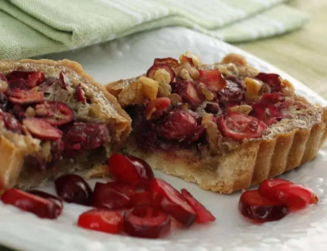 Cranberry and nut tartlets with pomegranate seeds
