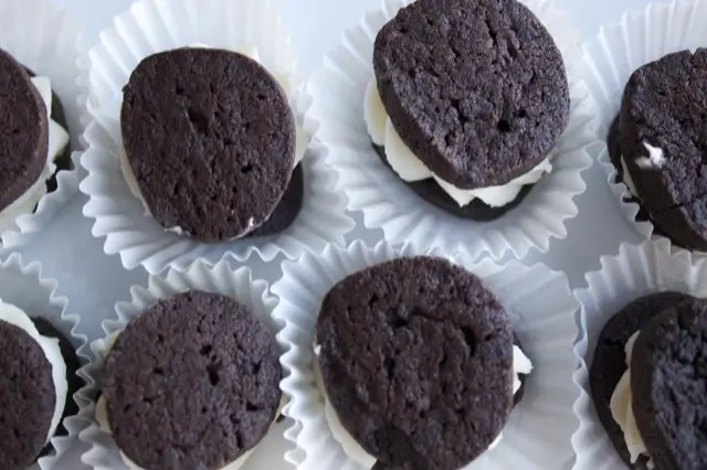 Homemade chocolate sandwich cookies in paper cups