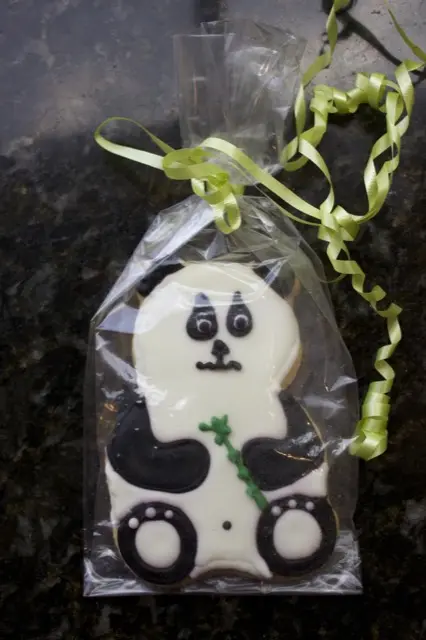 Decorated panda bear cookie in a gift bag
